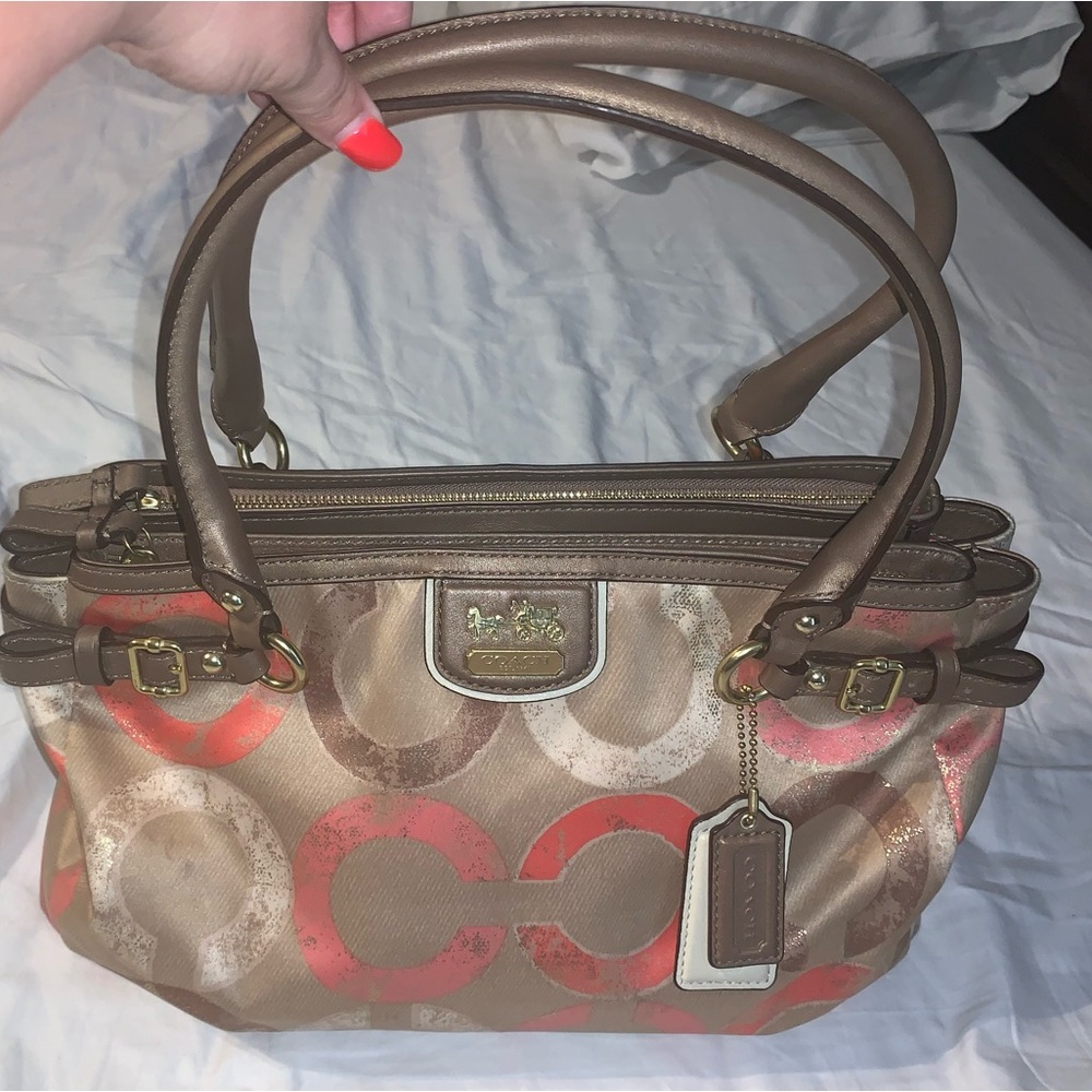 LN Coach Purse with Pink Satin on inside.